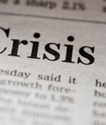 Newspaper headline reading "Crisis."